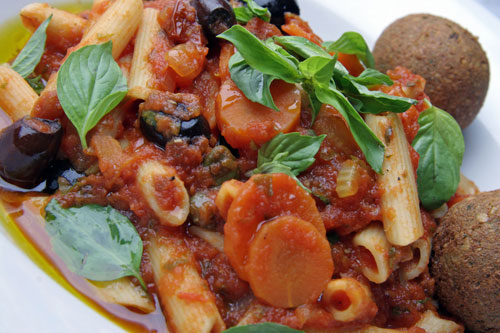 Penne with rich basil olive sauce, add a vetball or two